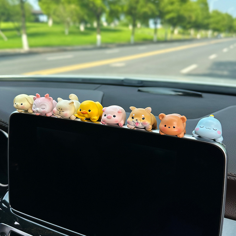 A computer decoration gift for the screen office space display in a car with a small piece of animals.