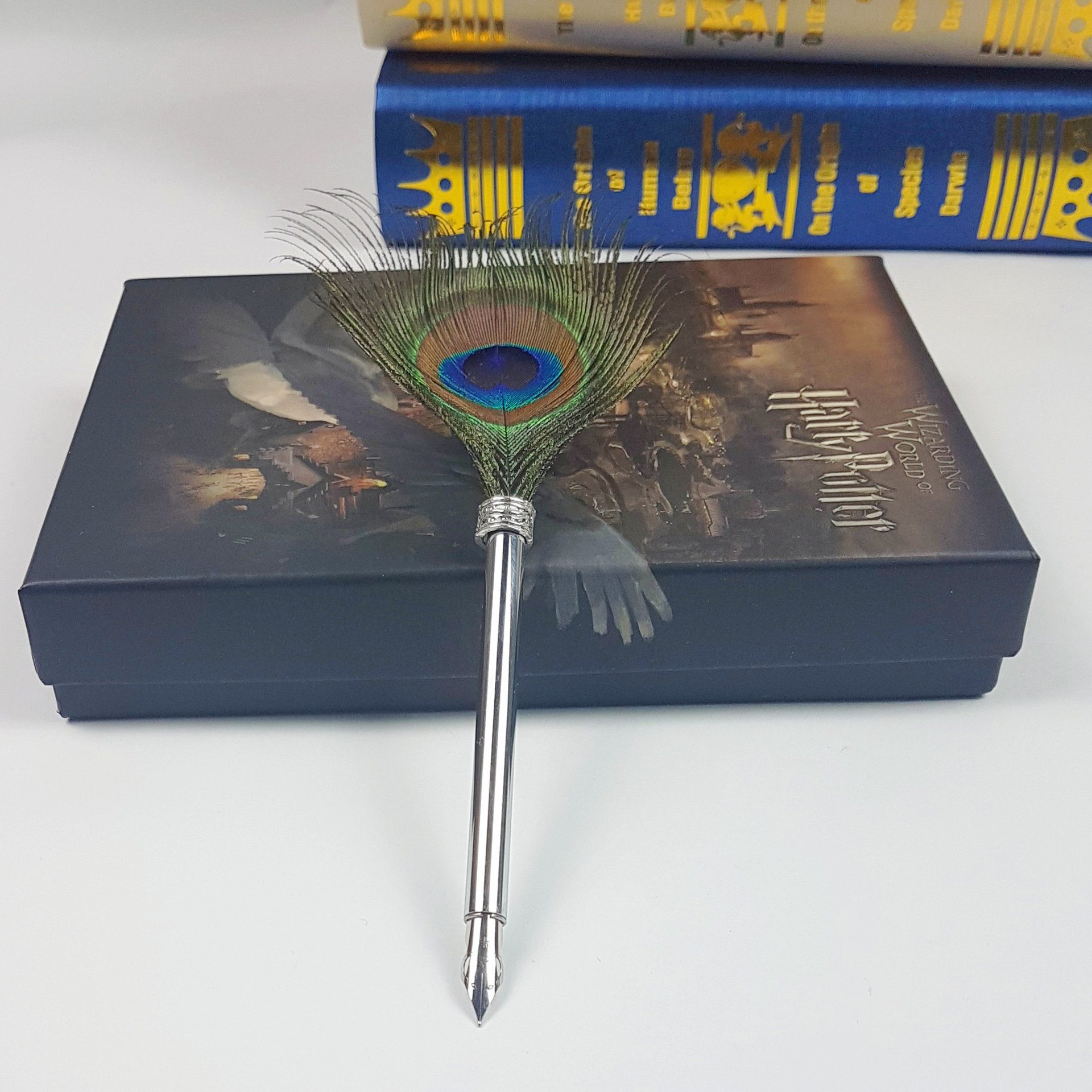 The mechanical punk wing feather pen, Harry Potter, the water pen ad, and the curry pen.