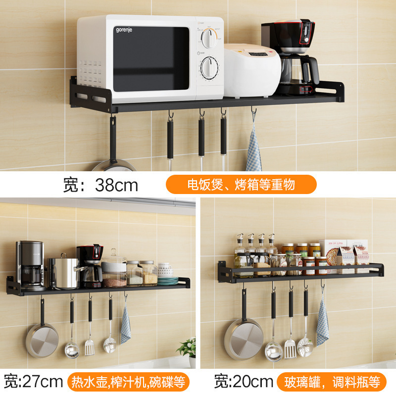 Tường thép không gỉ treo trên kệ lò vi sóng, lò nướng sơn màu đen, gạo điện. Thiết bị nấu ăn.