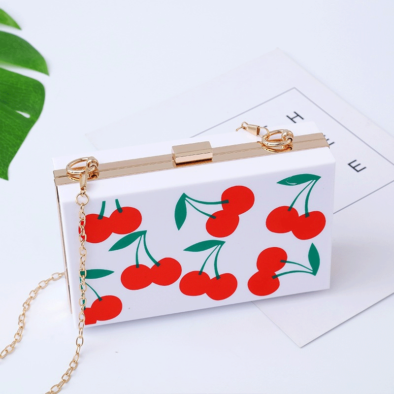 A new cherry-cracker bag with a bag and a handbag.