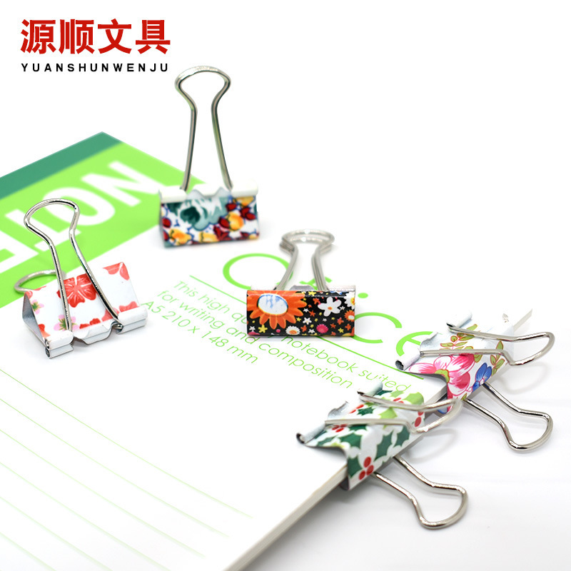 Cute little new printing paper with colored long tails and paper trial metal office clips