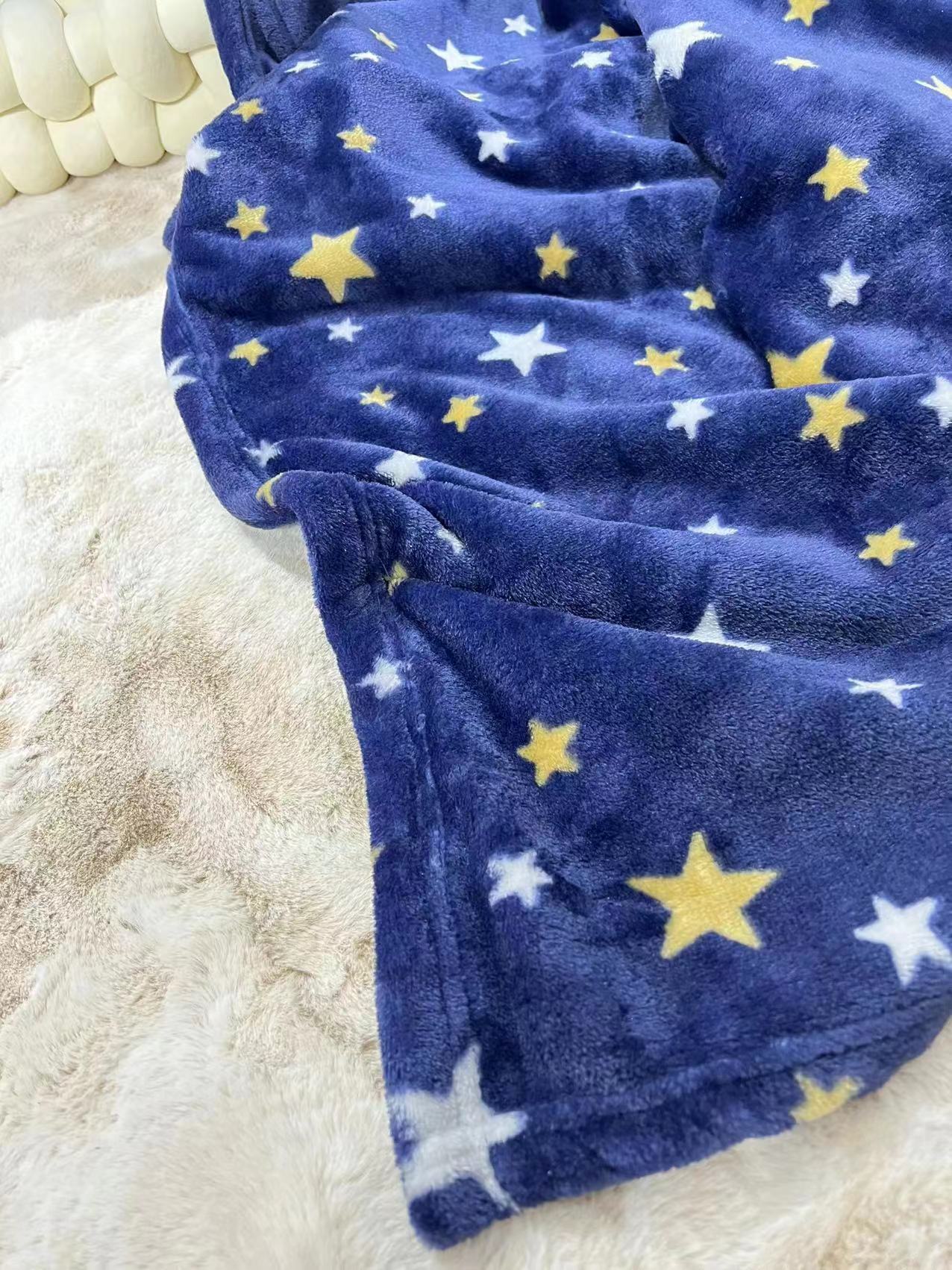 The blue star-printed office with a flannel blanket covering the Amazon.