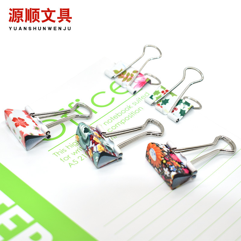 Cute little new printing paper with colored long tails and paper trial metal office clips