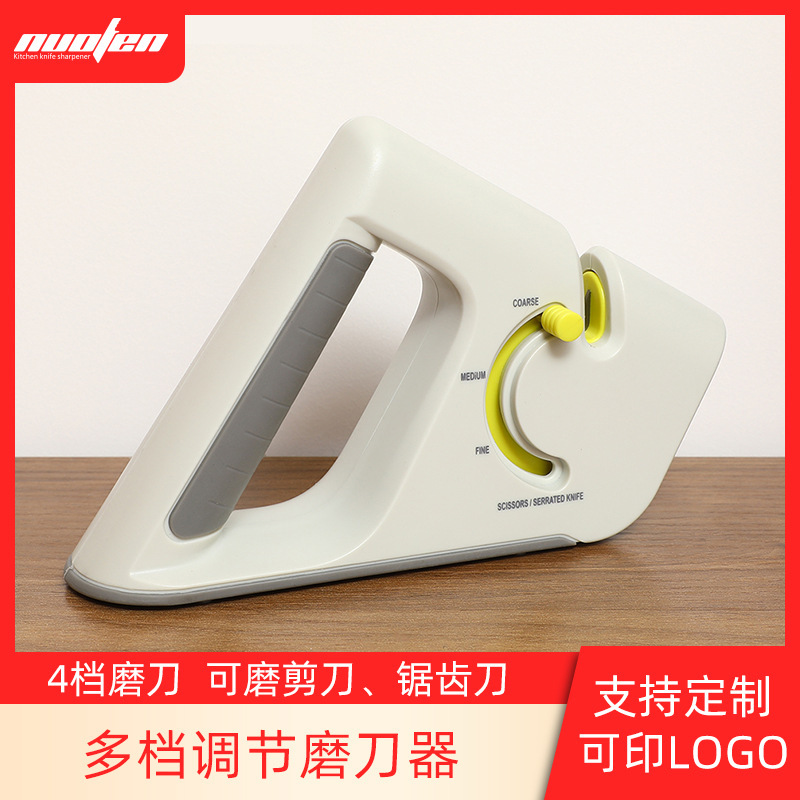 Kitchen's multipurpose sharpener tool, with a wholesale scissors and a hand grinder.