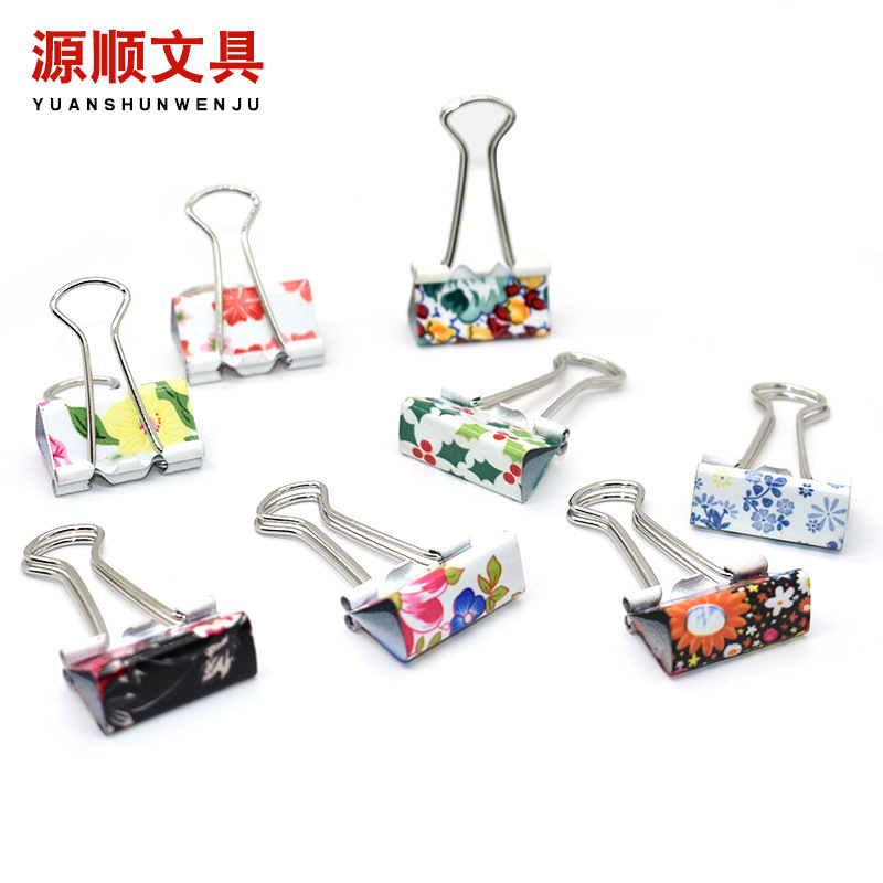 Cute little new printing paper with colored long tails and paper trial metal office clips