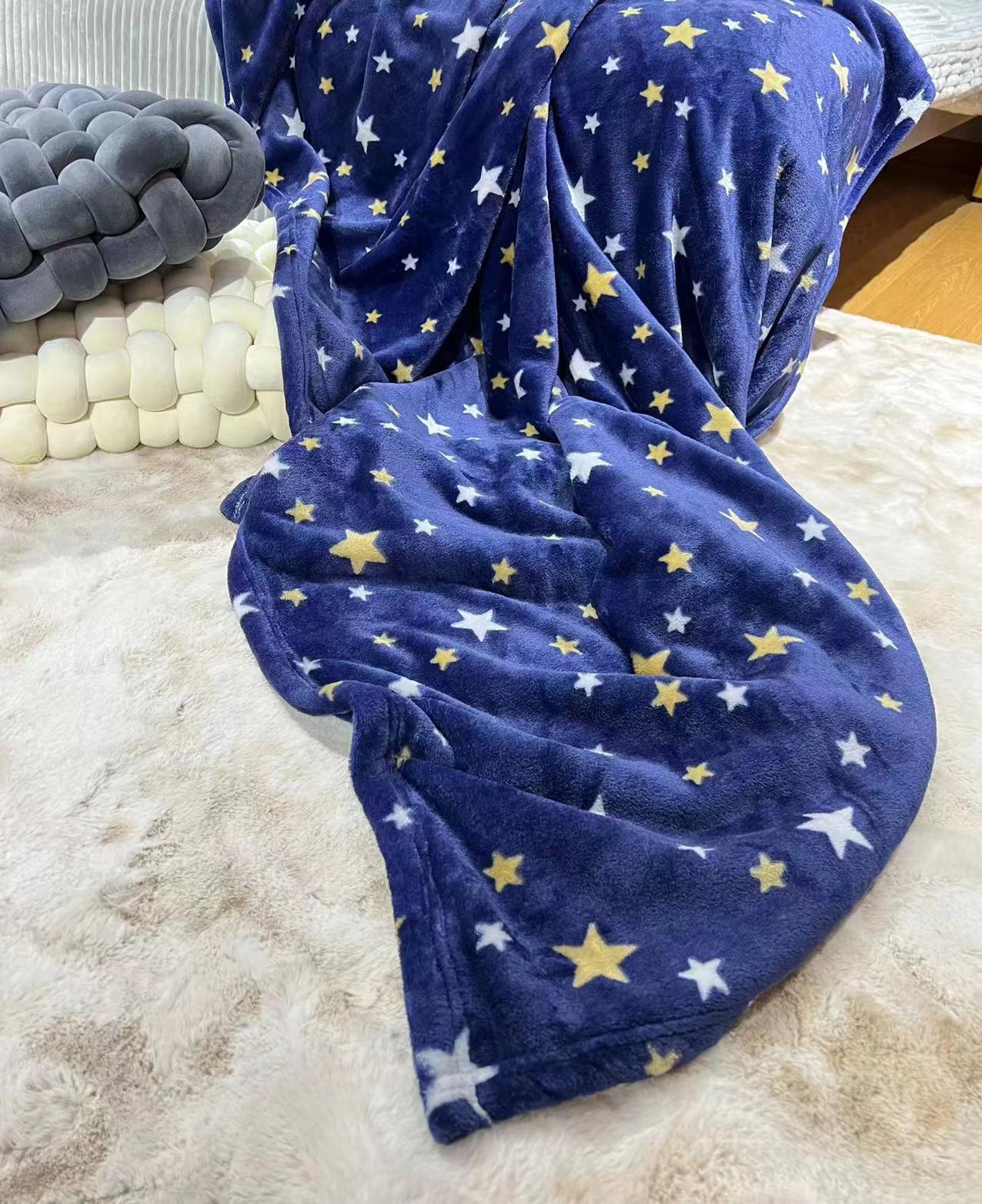 The blue star-printed office with a flannel blanket covering the Amazon.