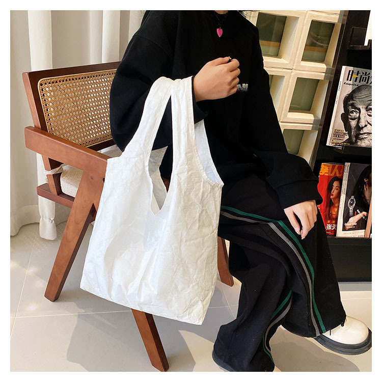 New 1443R white pit-stabbing du Pont paper folding packs of skin vests, female waterproof and green shopping bag.