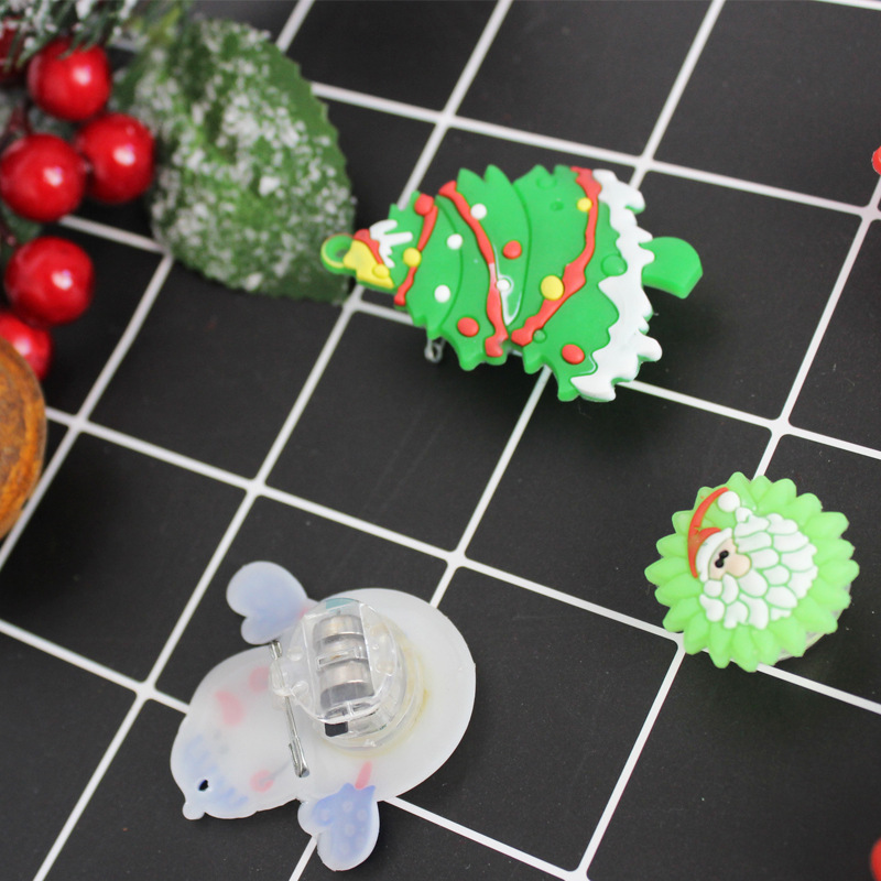 "Christmas tree decorated snowman with a Christmas pin and a Christmas medal."