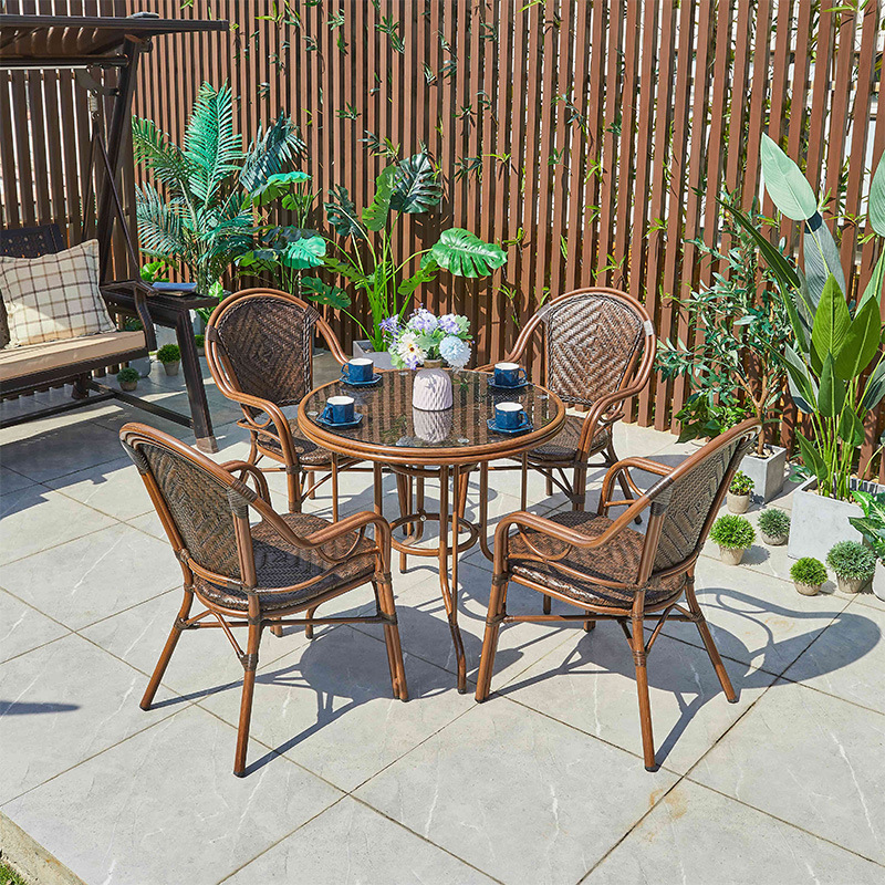 A table and a chair outside the garden garden, a table and a chair on the balcony.