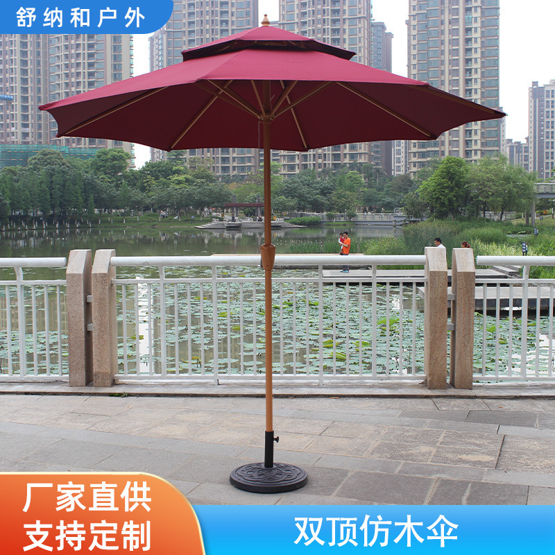 Two-caps of a wooden umbrella courtyard, thickened by an eight-bone commercial umbrella stand to block the distribution of an outdoor umbrella.