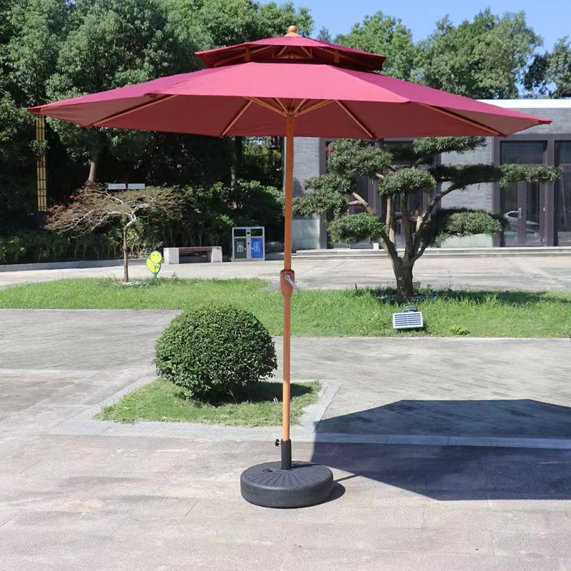 Two-top Milan umbrella courtyard balcony tables and chairs outside the umbrella room with sun umbrellas and outdoor beach umbrellas.