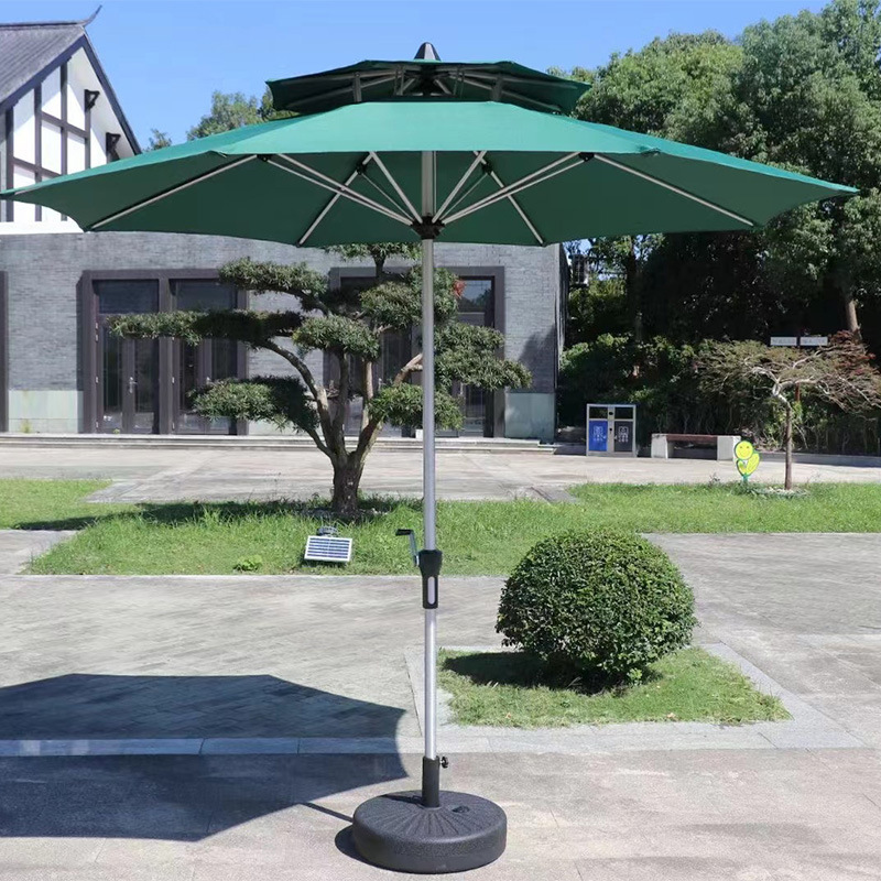 Two-top Milan umbrella courtyard balcony tables and chairs outside the umbrella room with sun umbrellas and outdoor beach umbrellas.