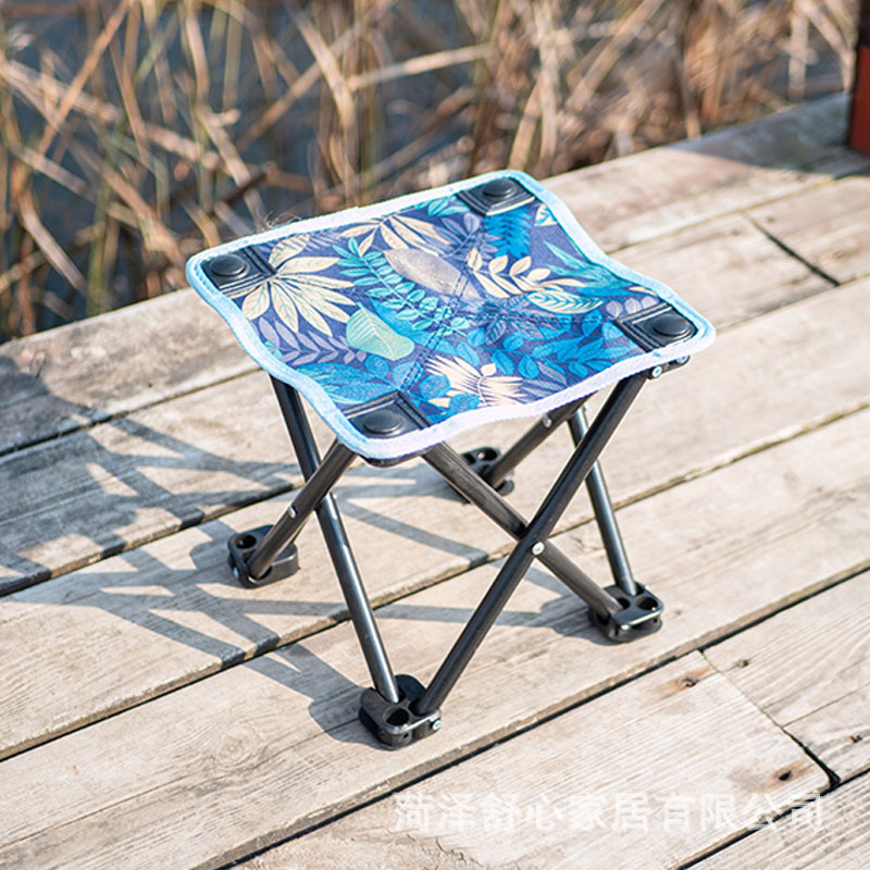 An outdoor portable folding chair doesn't have the back to catch a small chair with an Oxford folding stool.