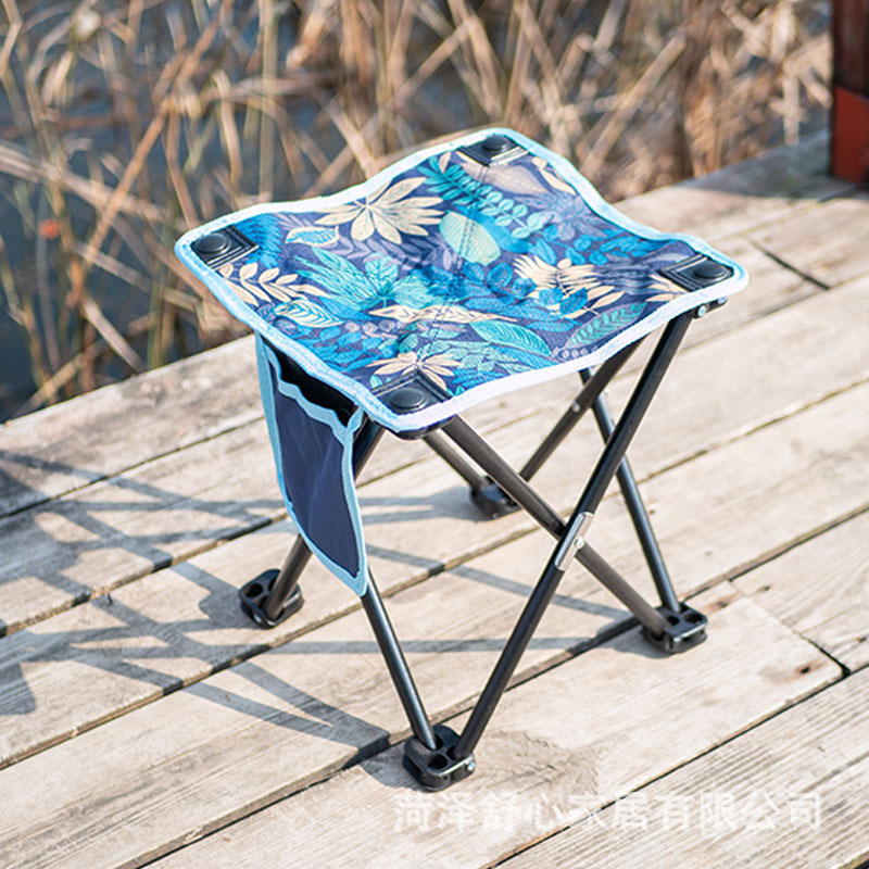 An outdoor portable folding chair doesn't have the back to catch a small chair with an Oxford folding stool.