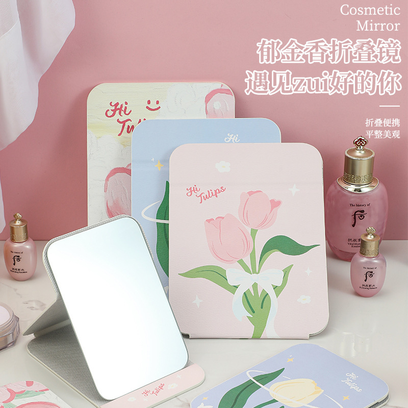 Một thư mục hoa tuy-líp nhỏ, một cô gái dựa trên môi trường với một trang điểm đẹp.