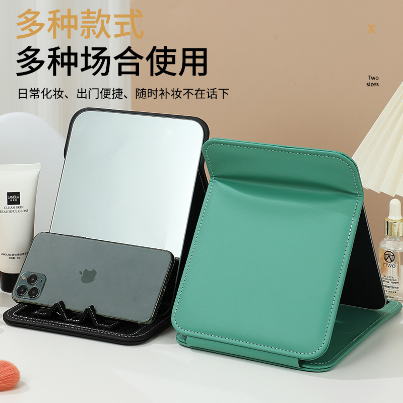 Cái giá điện thoại di động gấp cái bàn sinh viên đáng yêu với những tấm gương sạch dựa trên nhà.