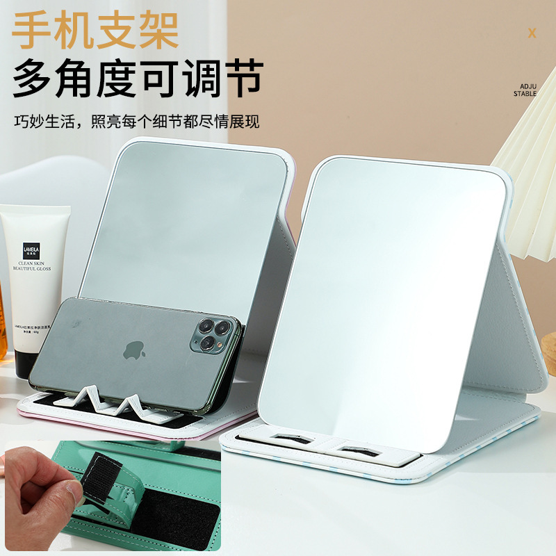Cái giá điện thoại di động gấp cái bàn sinh viên đáng yêu với những tấm gương sạch dựa trên nhà.