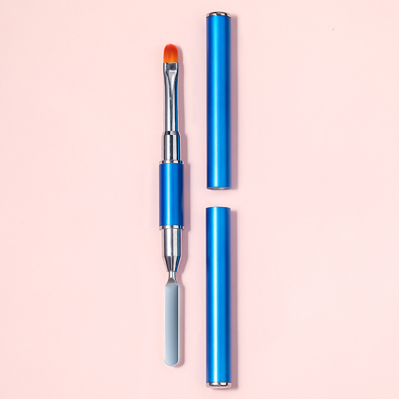 A platinum pen and a two-headed nail brush.