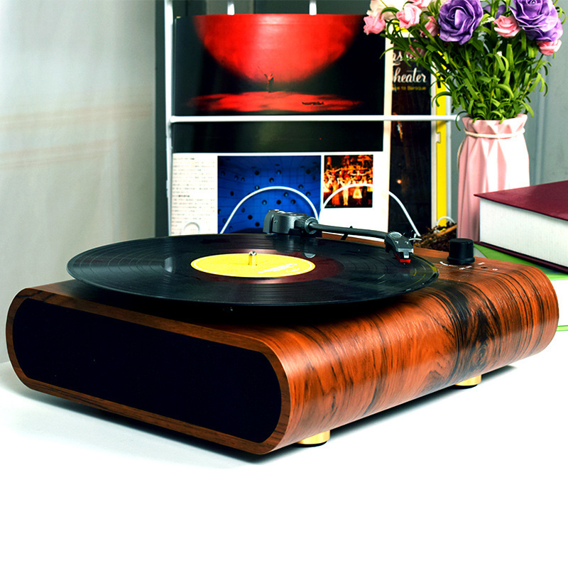 Multi-purpose black tape recorder phonographs with speaker-charging and hand-held bluetooth slots