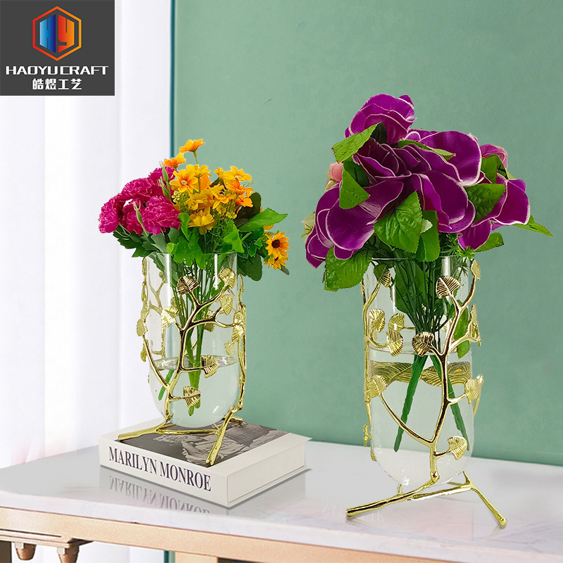 A vase set in the luxurious vase room with a bouquet of modern home-based soft decorations.