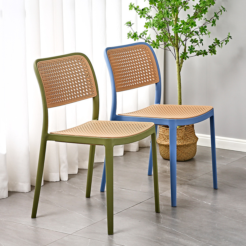 The Nordic plastic chair is used outside the house in a folded dining chair net, in the back of a small household desk and desk.