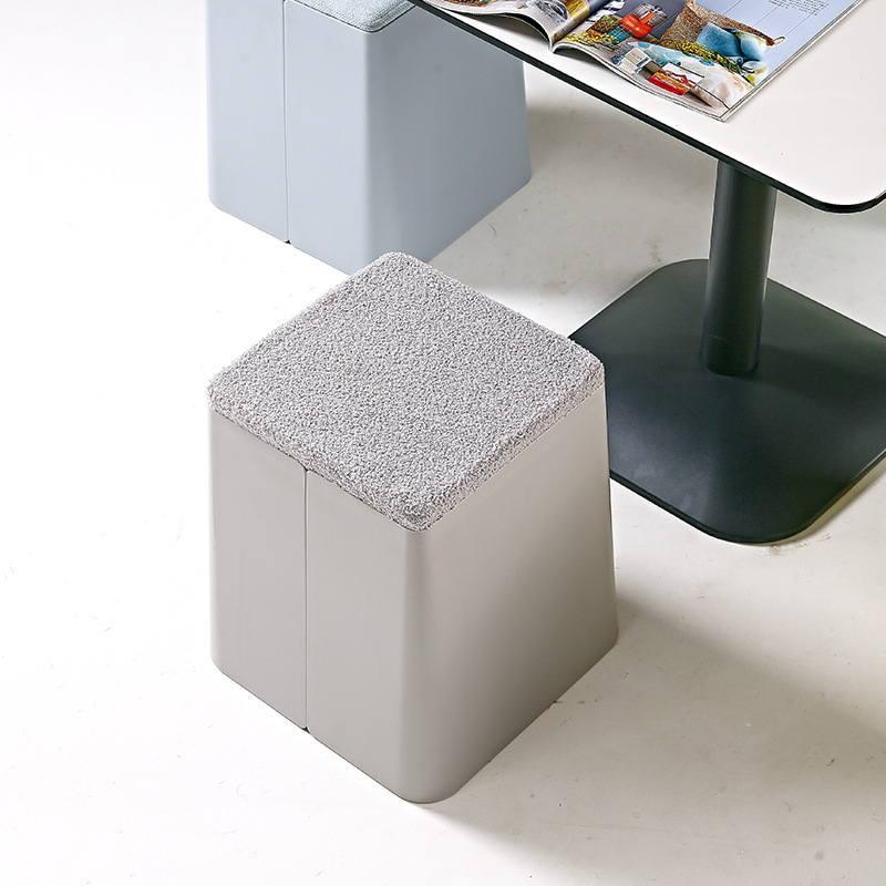 A small sitting in a red-hot restaurant with a mobile stool for modern plastic stool multifunctional storage.