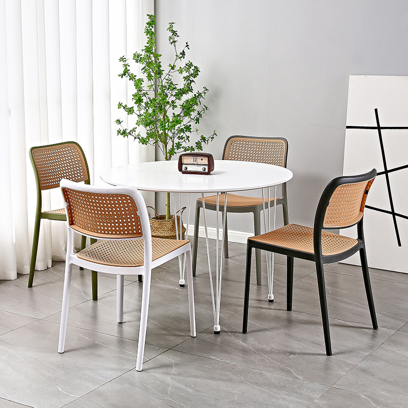 The Nordic plastic chair is used outside the house in a folded dining chair net, in the back of a small household desk and desk.