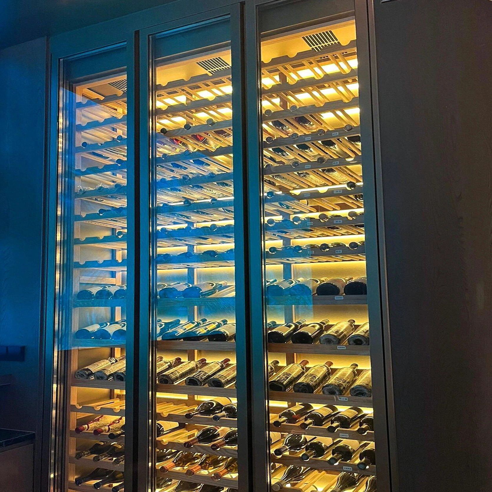 Customization of the wine cellar's commercial wine shelf glowing to show stainless steel hotness on the wall.