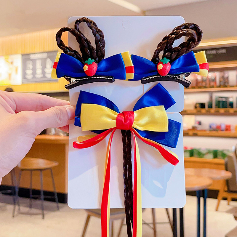 Children with butterflies and a girl with snow white head and a little girl with a baby card.