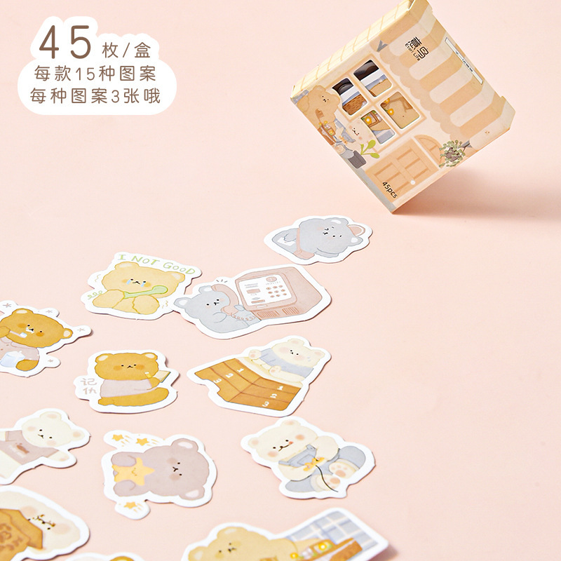 Một con chim, một cái hộp dán nhãn, 45 miếng giấy trang trí và giấy không giấy dán.