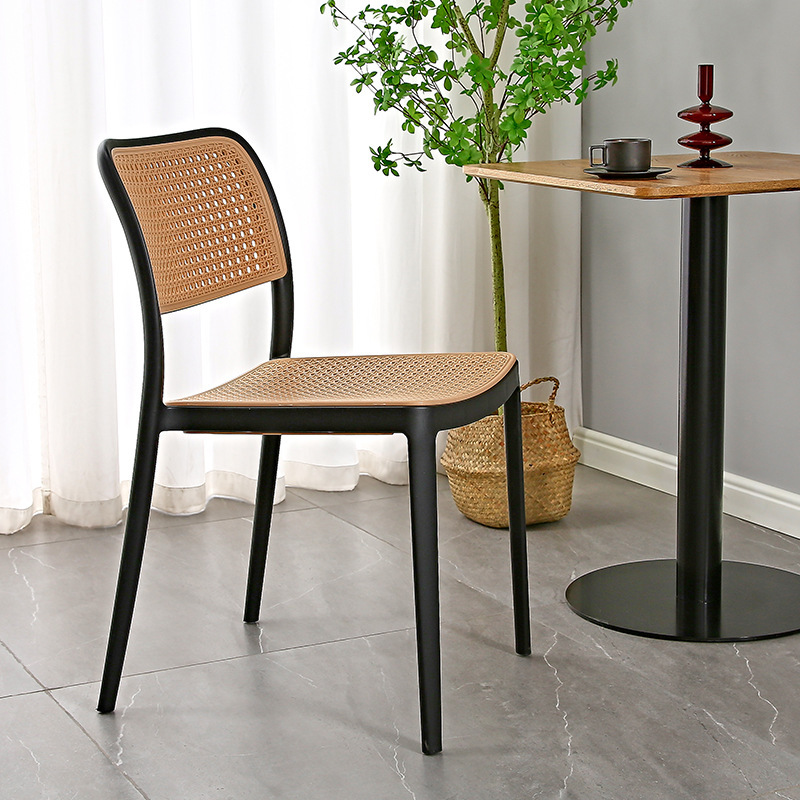 The Nordic plastic chair is used outside the house in a folded dining chair net, in the back of a small household desk and desk.