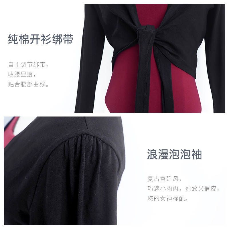 The adult ballet dress and dance coat with a black and white shirt and long sleeves.