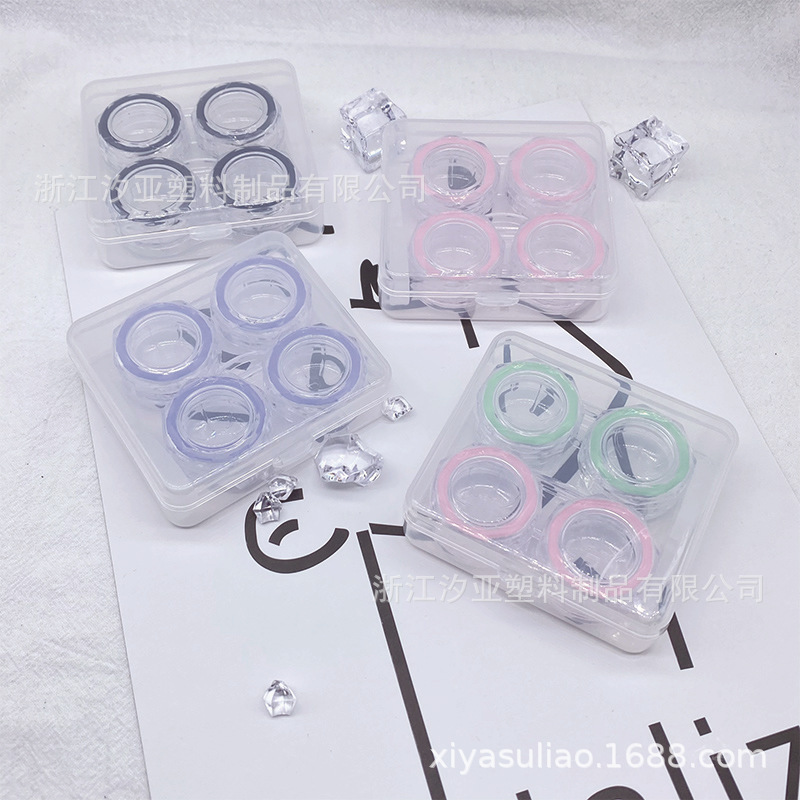 Two pairs of Opaque Pussy Boxes for contact lenses.