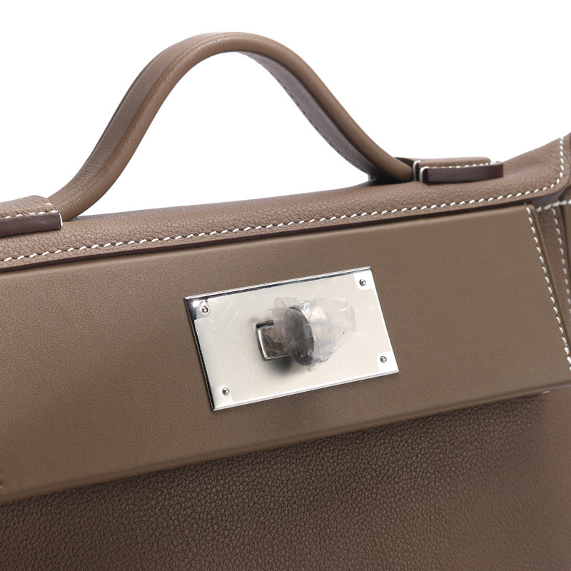 "H's original hand-sewn wax liner, Eve Swift skin, 2424 Kelly's one-shoulder-slashed leather bag."