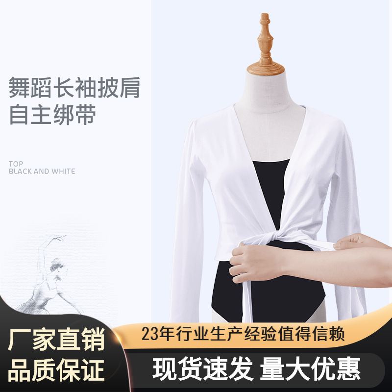 The adult ballet dress and dance coat with a black and white shirt and long sleeves.