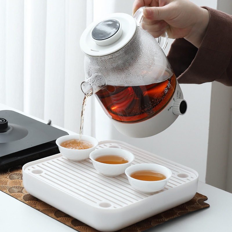 The tea cooker cooks a teapot with a multi-purpose steamer, all automatic.