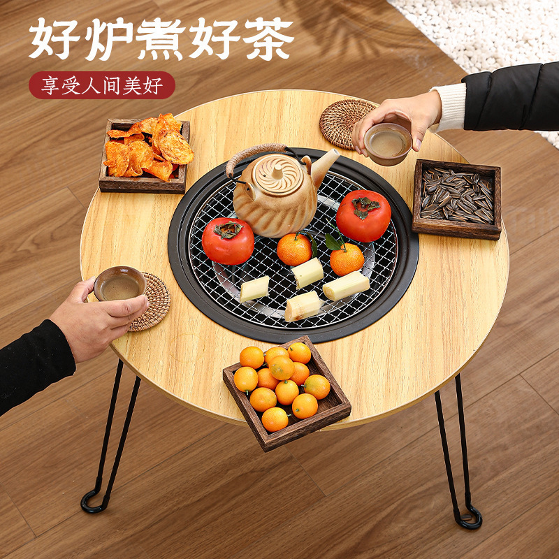 Trong các lò sưởi ngoài trời nơi nấu trà, các lò nướng bàn cắm trại sử dụng lò nướng xếp nhiều mục đích để sưởi ấm.