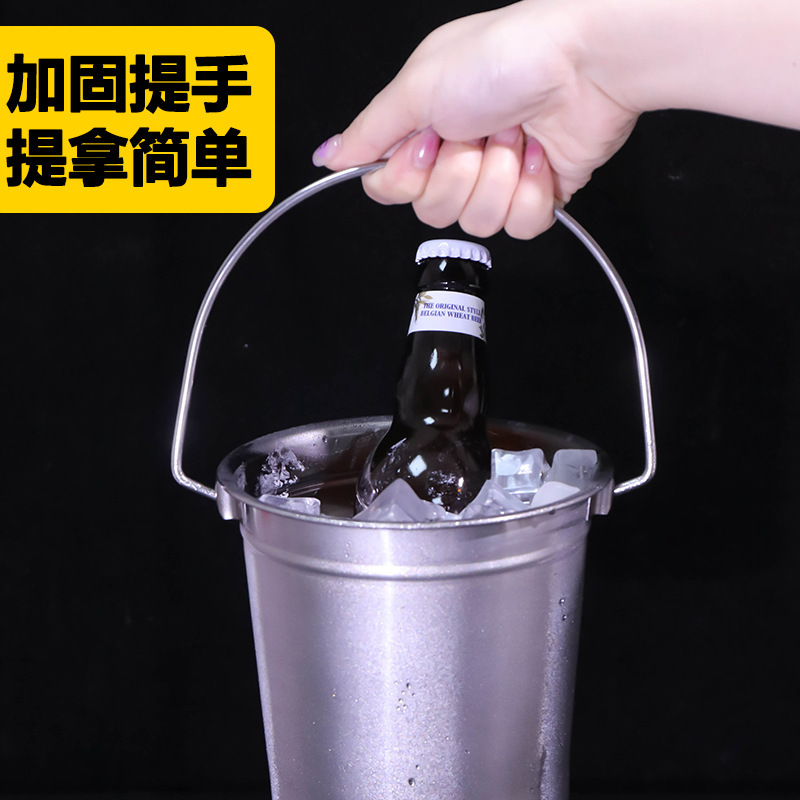 The stainless steel bucket of champagne and beer.