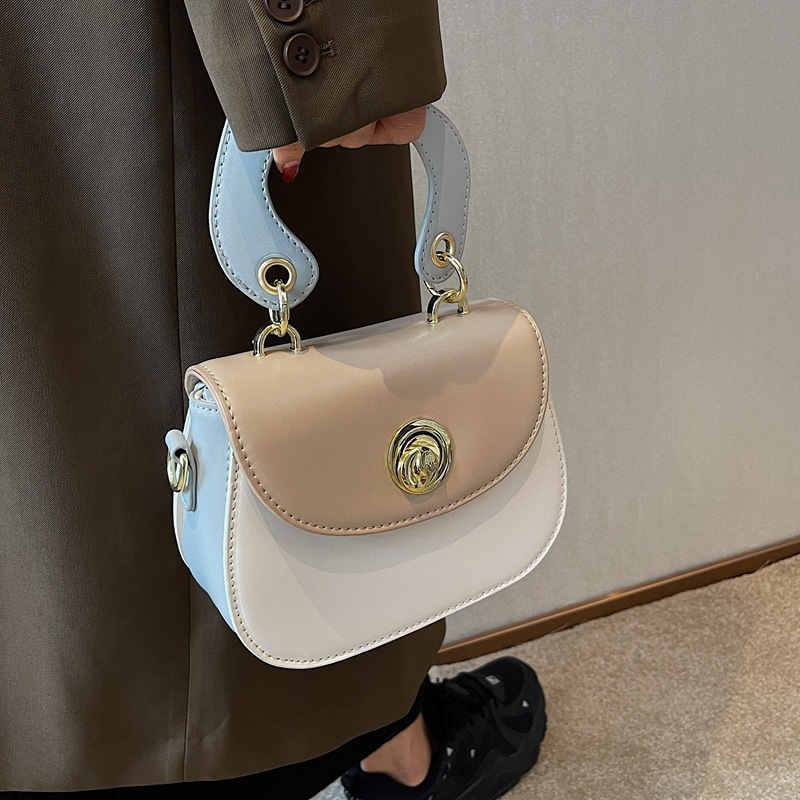 306617 New foreign trade cross-border women ' s bag 2022 designed a hand-held one-shouldered saddle bag