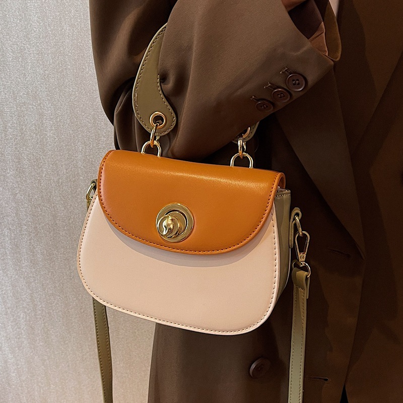 306617 New foreign trade cross-border women ' s bag 2022 designed a hand-held one-shouldered saddle bag