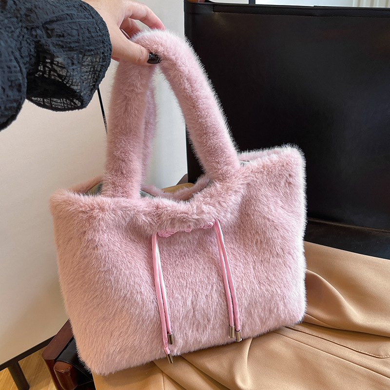 A large-capacity fur bag with a new 2024 hand-held velvet undercarriage for students to commute to and from one shoulder to another.