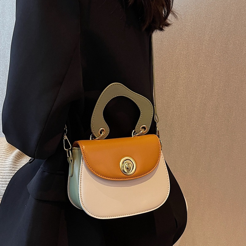 306617 New foreign trade cross-border women ' s bag 2022 designed a hand-held one-shouldered saddle bag
