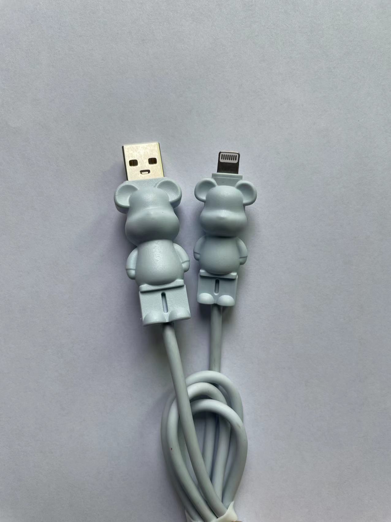 Creative cartoon bear-mounted key-button violent bear data lines apply to apple gift USB chargers.