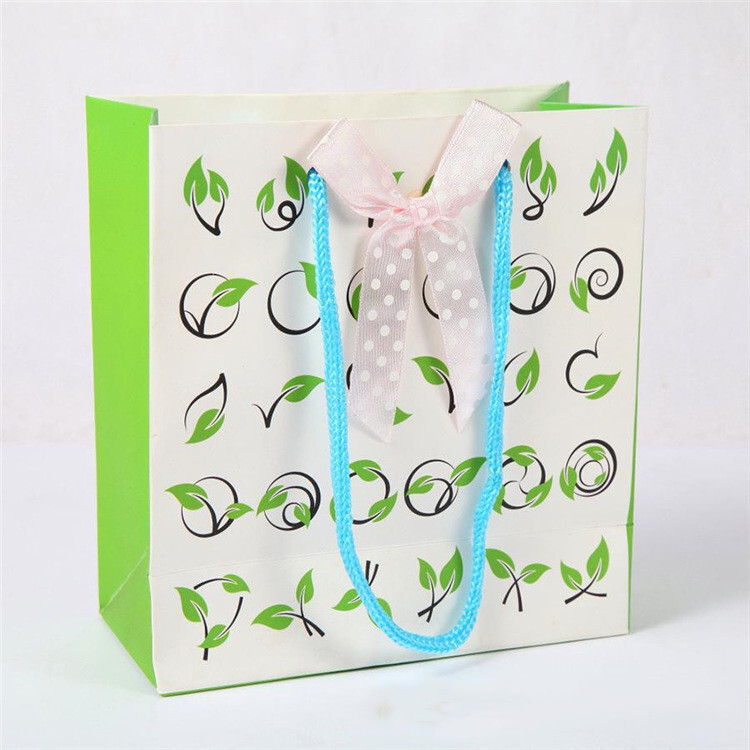 The company handbags are customised with white carded paper and paper bags for a gift bag for a gift shop.