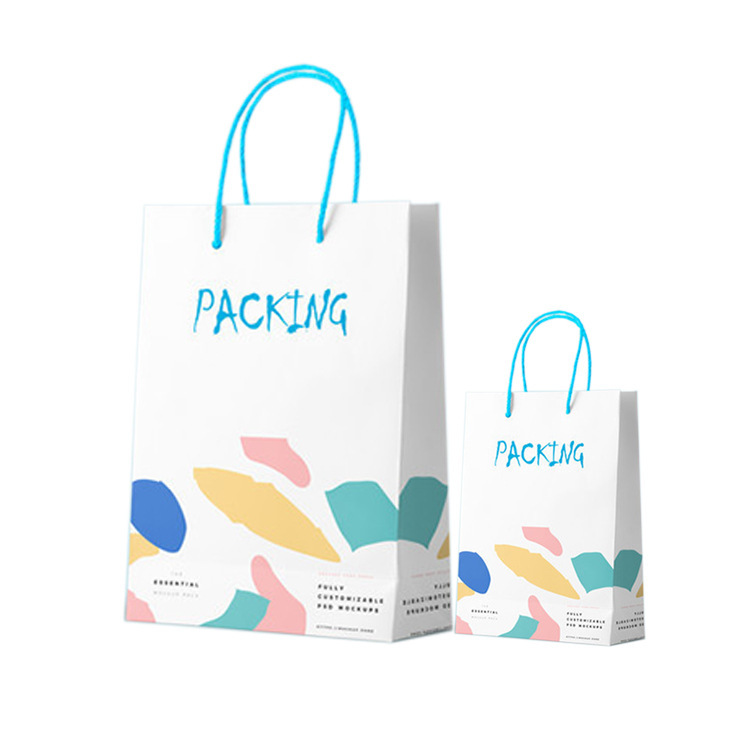 The company handbags are customised with white carded paper and paper bags for a gift bag for a gift shop.