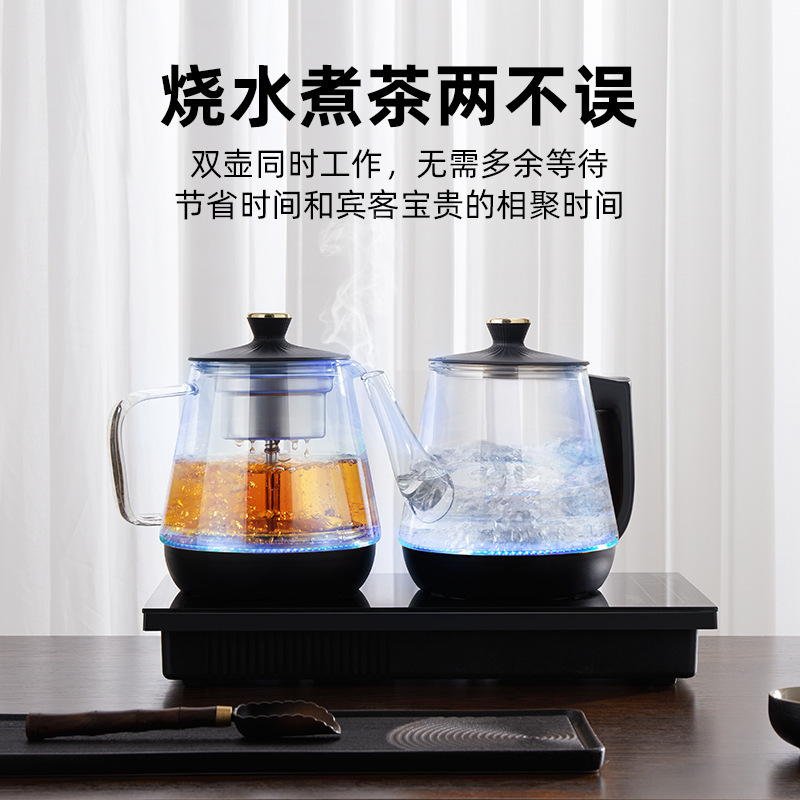 Full automatic bottom water kettle with glass handles embedded in a tea table.