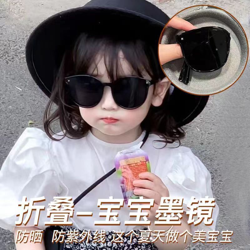 A child can fold his or her parental sunglasses to protect him or her from the sun.