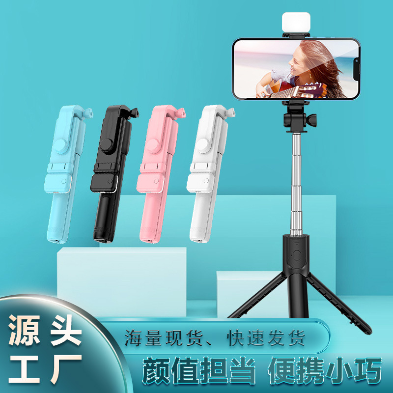 Cái giá điện thoại di động với một cái răng cưa đặt một cái cáng 3 chân xuống đất, và rồi một miếng vá nhẹ.
