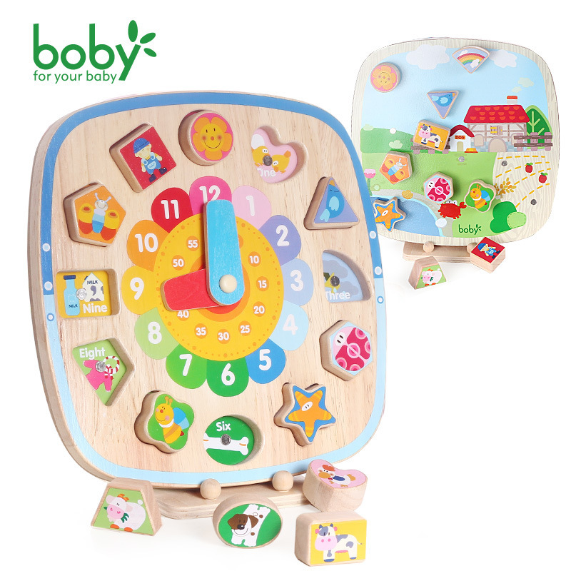 Bobby, a child aged 1-2-3 years with a pair of built-up magnetic clocks graphic early enlightenment cognitive wisdom toys