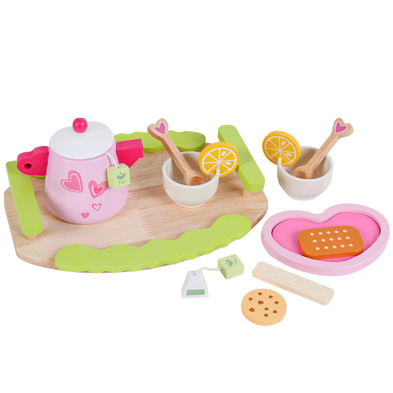 Wooded past home with a tea and dessert set to play the role of a child in the kitchen, imitating a real-life interactive toy.